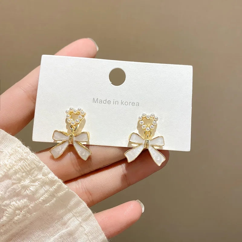 White Bowknot Earrings: Pearl Heart Pendant, Korean Style - Shop N Save