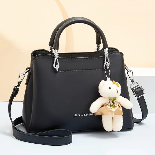 Women's Black Casual Large Capacity Handbag with Bear Pendant Double Handle Zipper Closure Synthetic Leather Exterior and Polyester Interior. - Shop N Save