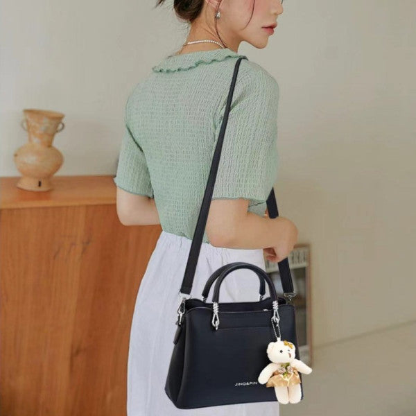 Women's Black Casual Large Capacity Handbag with Bear Pendant Double Handle Zipper Closure Synthetic Leather Exterior and Polyester Interior. - Shop N Save