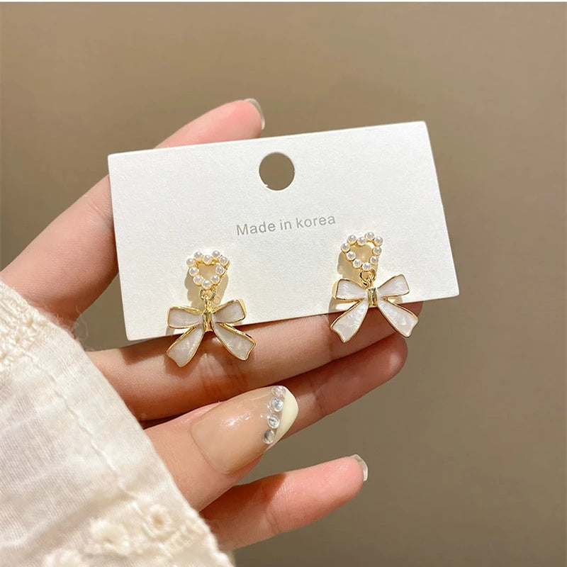 White Bowknot Earrings: Pearl Heart Pendant, Korean Style - Shop N Save