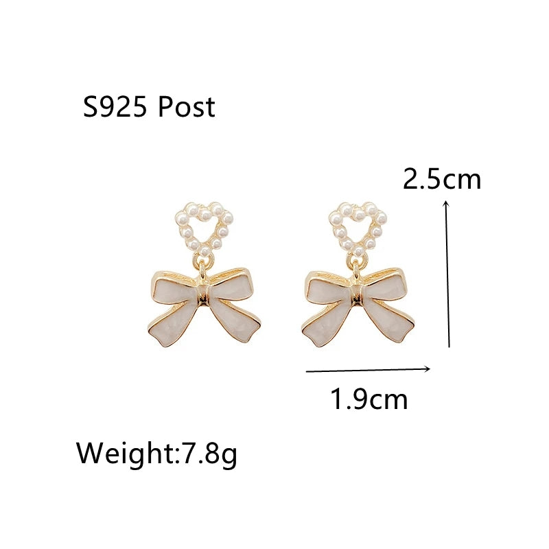 White Bowknot Earrings: Pearl Heart Pendant, Korean Style - Shop N Save