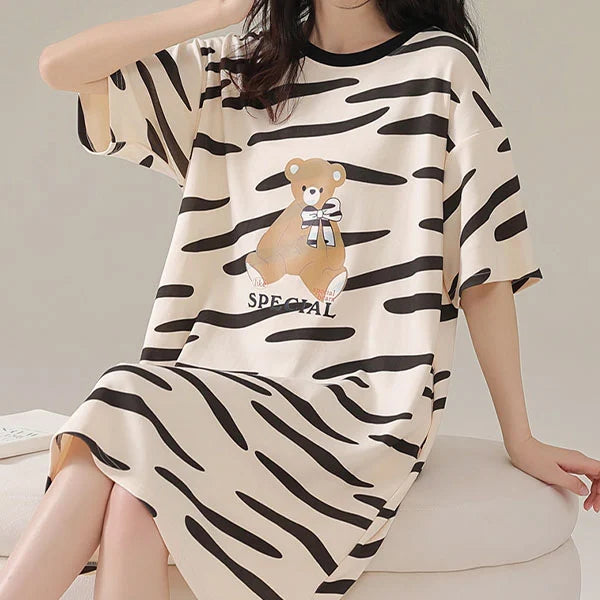 Stay Comfy and Stylish with our Striped Print Midi Night Dress! Perfect for Lounging at Home or Getting a Good Night's Sleep. Available in Black with Short Sleeves and a Loose Fit. Made from Terylene and Cotton Blends. Must-Have for Women!