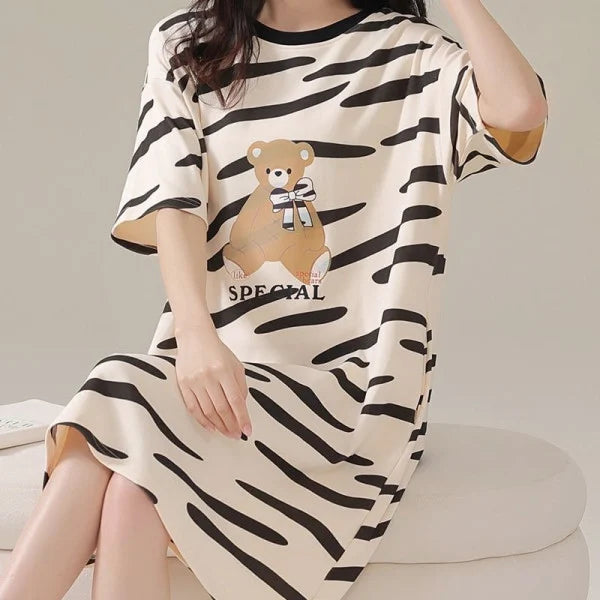 Stay Comfy and Stylish with our Striped Print Midi Night Dress! Perfect for Lounging at Home or Getting a Good Night's Sleep. Available in Black with Short Sleeves and a Loose Fit. Made from Terylene and Cotton Blends. Must-Have for Women!