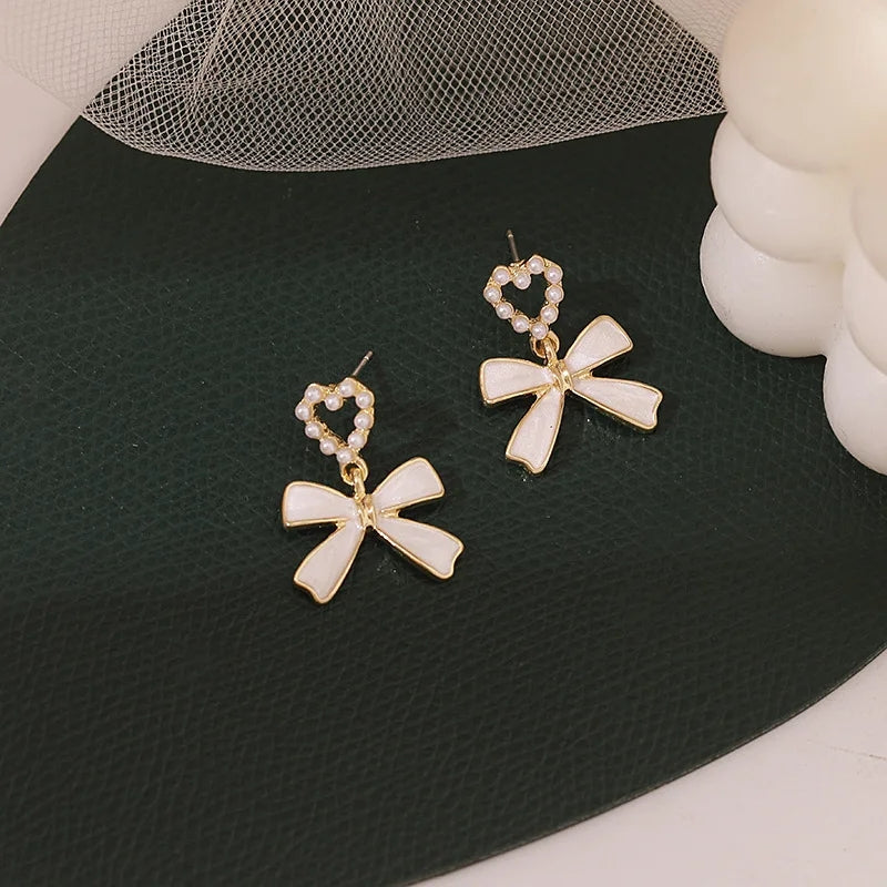 White Bowknot Earrings: Pearl Heart Pendant, Korean Style - Shop N Save