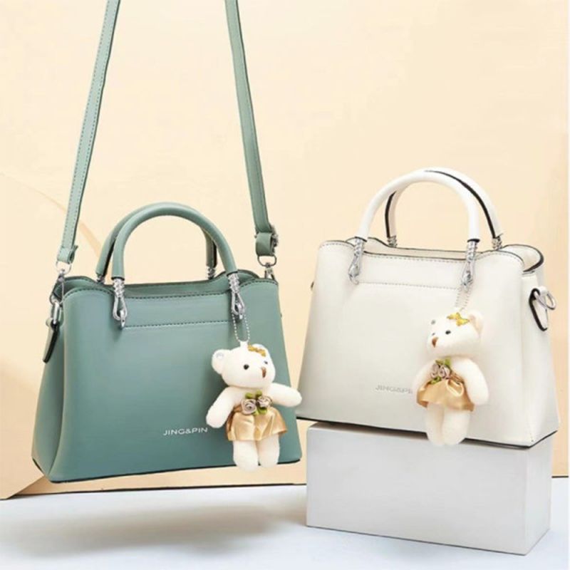 Green Stylish Handbag: Cute Pendant, Double Handles, Fashionable Charm