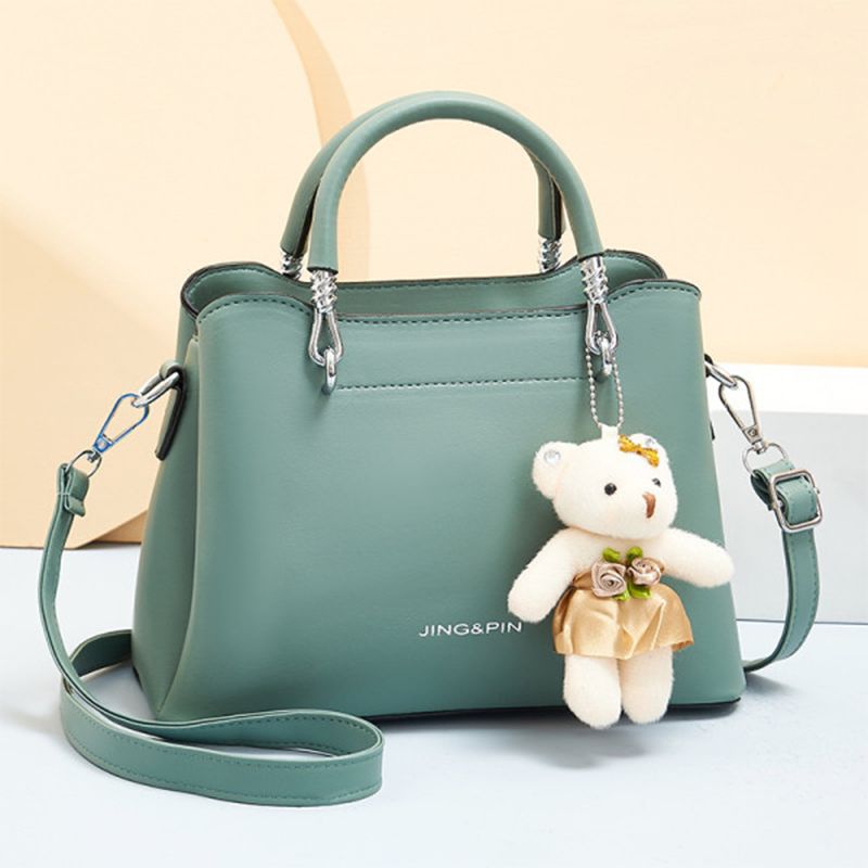 Green Stylish Handbag: Cute Pendant, Double Handles, Fashionable Charm