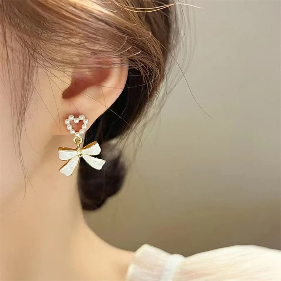 White Bowknot Earrings: Pearl Heart Pendant, Korean Style - Shop N Save