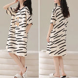Stay Comfy and Stylish with our Striped Print Midi Night Dress! Perfect for Lounging at Home or Getting a Good Night's Sleep. Available in Black with Short Sleeves and a Loose Fit. Made from Terylene and Cotton Blends. Must-Have for Women!