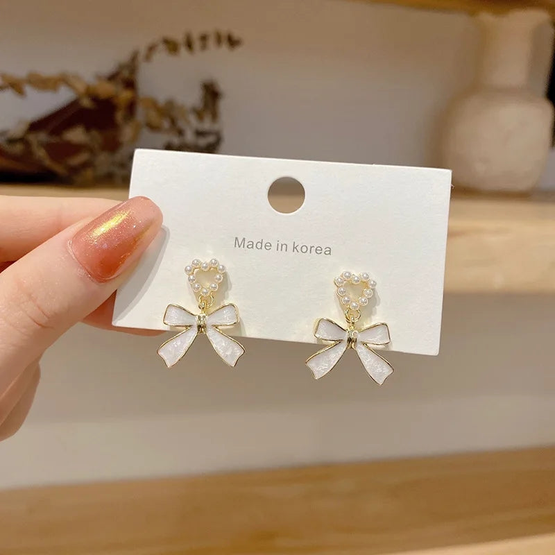 White Bowknot Earrings: Pearl Heart Pendant, Korean Style - Shop N Save