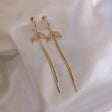 Ladies Rhinestone Fish Tail Tassel Earrings - Golden - Shop N Save