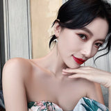 Ladies Rhinestone Fish Tail Tassel Earrings - Golden - Shop N Save