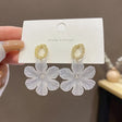 Golden Hands &amp; White Flower Earrings: Exaggerated Port Style - Shop N Save