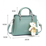 Green Stylish Handbag: Cute Pendant, Double Handles, Fashionable Charm